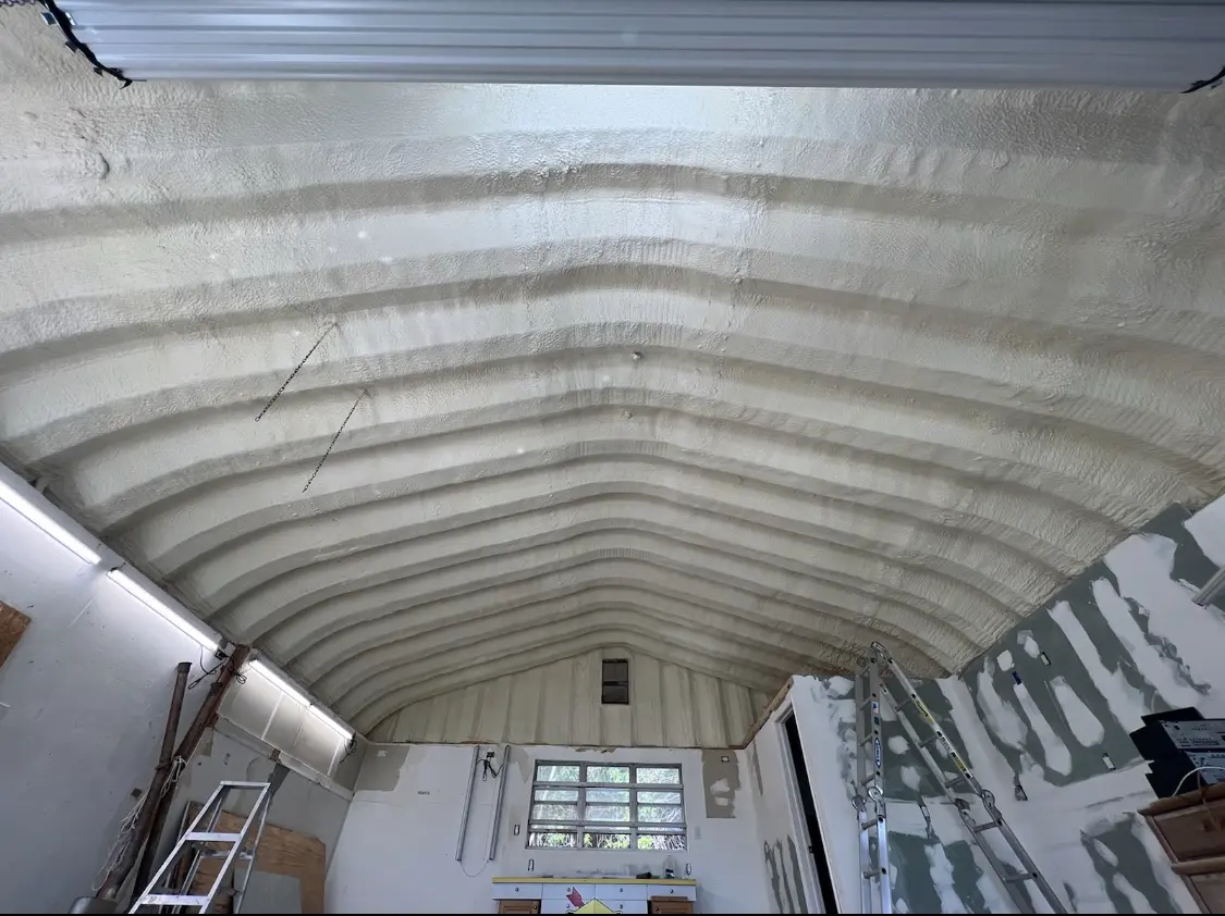 Spray polyurethane foam applied to the underside of a metal roof deck in Taylorville